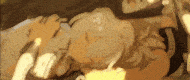 a blurry picture of a person laying down with a candle