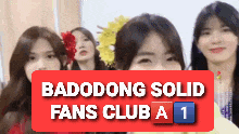 a group of girls are standing next to each other with the words badodong solid fans club a 1