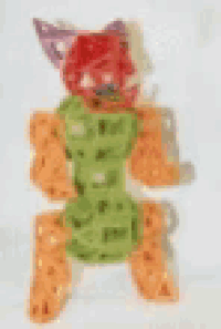 a stuffed animal with a green shirt and a red head is holding a glove .