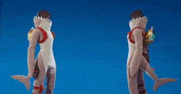 two people in shark costumes holding hands against a blue background