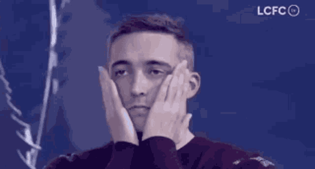 a man with a surprised look on his face with lcfc written on the bottom