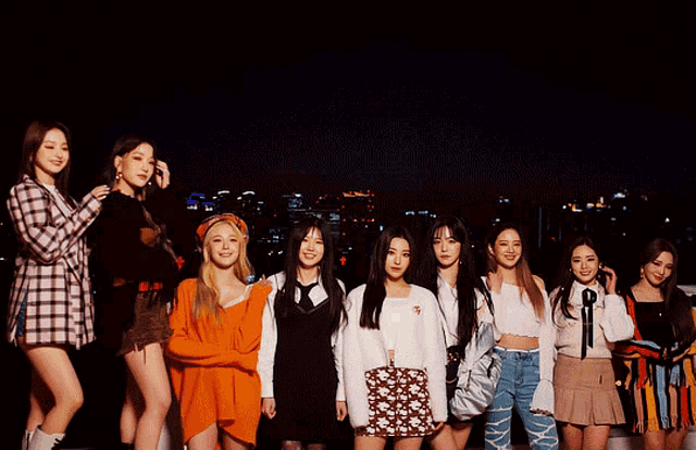 a group of girls are posing for a picture together