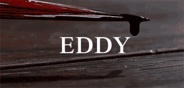 the word eddy is on a piece of wood