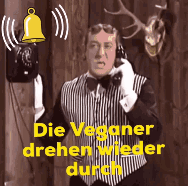 a man talking on a telephone with the words die veganer drehen wieder durch