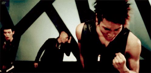 a man in a black tank top with the letters dir on the bottom left