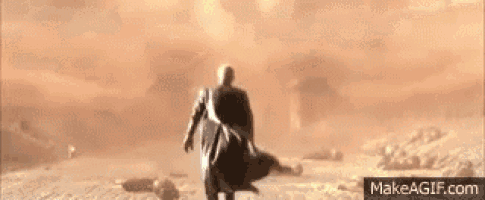 a man is running away from a huge explosion in the desert .