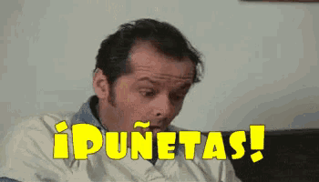 a man is sitting on a couch with the words idunetas written in yellow