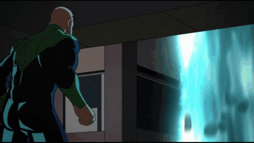 a man in a green jacket is standing in front of a window