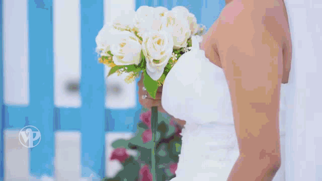 a man in a tuxedo is standing next to a woman in a white dress