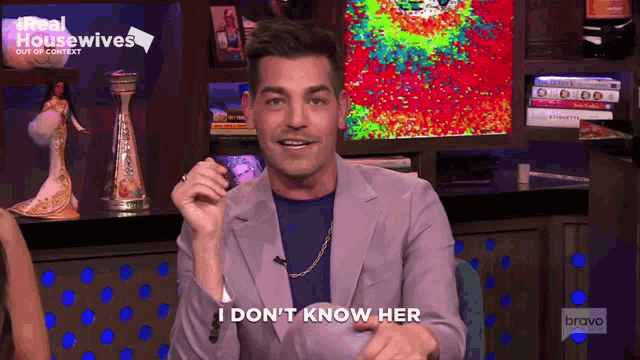 a man says i do n't know her in front of a bravo sign