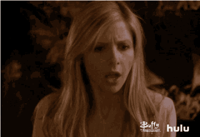 a woman 's face is shown in a buffy the vampire slayer advertisement