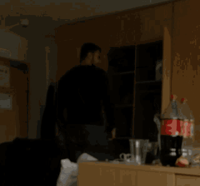 a bottle of coke sits on a wooden table