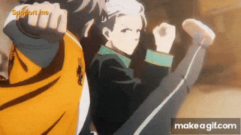 a couple of anime characters standing next to each other with their fist in the air .