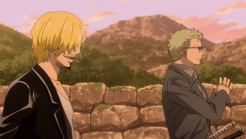 a man with a cigarette in his mouth stands next to another man in a suit