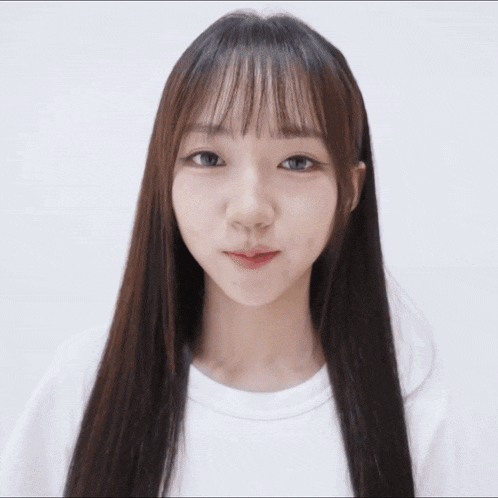 a woman with long hair has her eyes closed