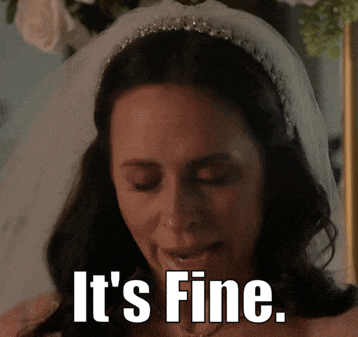 a woman in a wedding dress with the words it 's fine written on her face