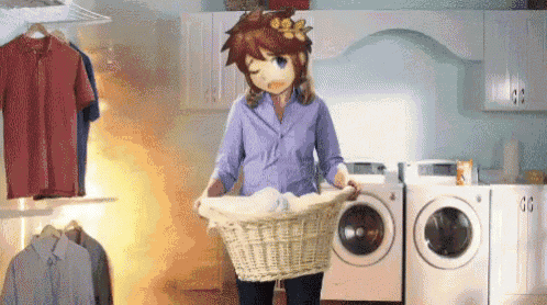 a woman is holding a laundry basket in a laundry room next to a washer and dryer .
