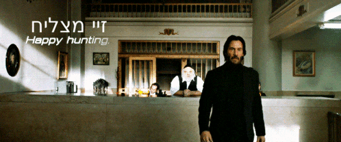 a man in a suit stands in front of a counter with the words happy hunting written above him