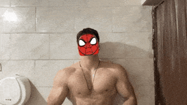 a shirtless man wearing a spider man mask on his face