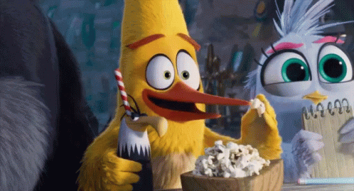 Eating Popcorn Listening GIF - Eating Popcorn Listening Paying Attention GIFs
