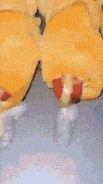 a close up of a pastry with a strawberry filling on a blue surface