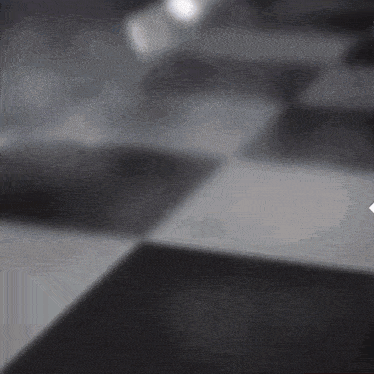 a black and white checkered floor with a red arrow pointing to the right