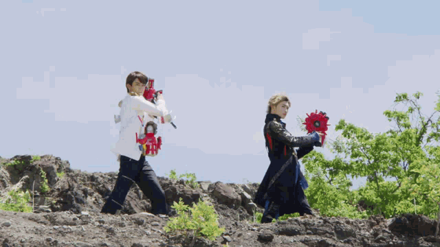 a man and a woman walking on a rocky hillside