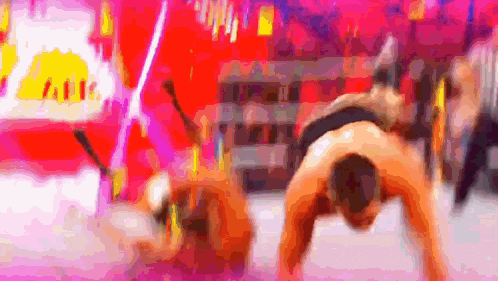a blurry picture of a man doing a handstand in front of a sign that says ' a ' on it