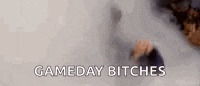 a person is standing in a room with smoke coming out of their mouth and the words `` gameday bitches '' .