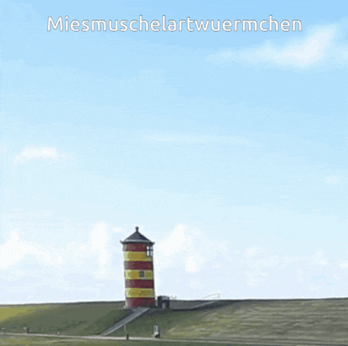 a lighthouse on top of a grassy hill with the words miesmuschelartwurmchen below it