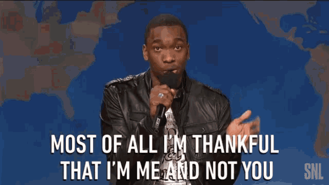 a man speaking into a microphone that says most of all i 'm thankful