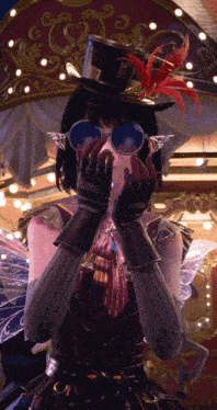 a woman wearing a top hat and glasses covering her face
