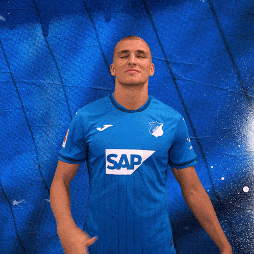 a man is wearing a blue shirt with the word sap on it