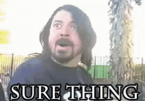 a man with long hair and a beard is standing in front of a tree with the words `` sure thing '' written above him .