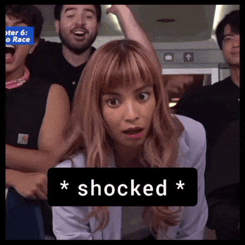 a woman with a surprised look on her face is surrounded by people and the word shocked is above her