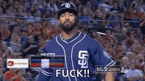 a baseball player in a blue uniform is standing in front of a crowd and says fuck !