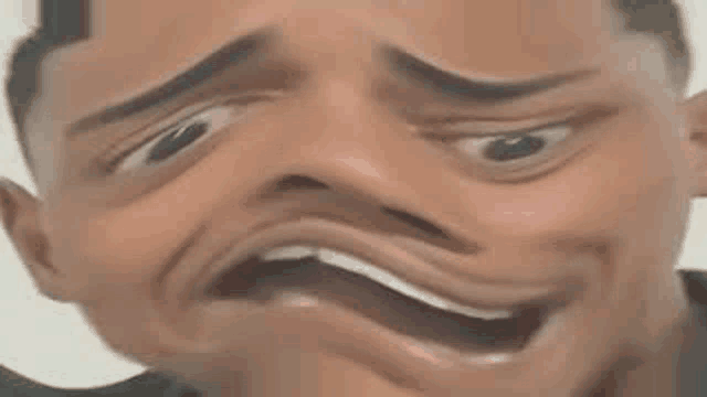 a close up of a man making a funny face with his mouth wide open .