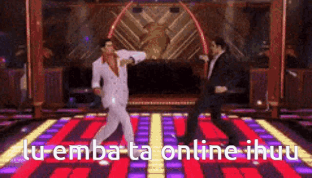 two men are dancing on a dance floor with the words " tu emba ta online ihuu " written below them