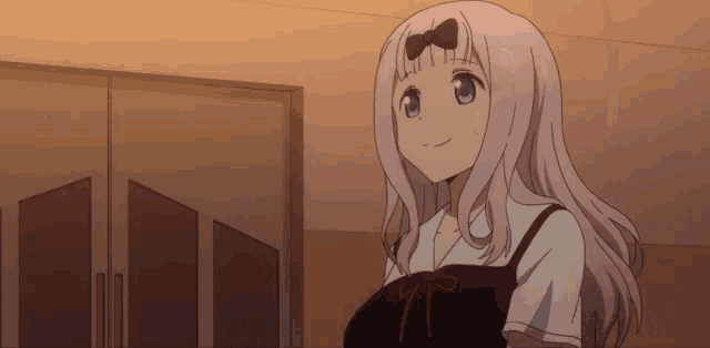 a girl with a bow in her hair is smiling