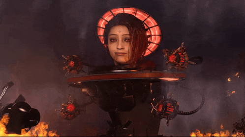 a statue of a woman with a halo around her head is surrounded by flames