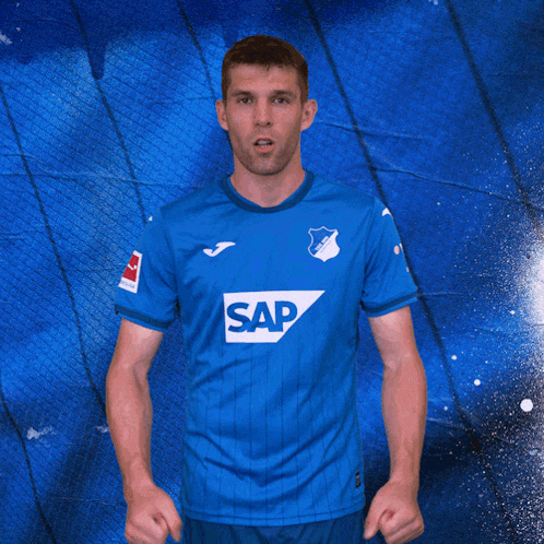 a man in a blue shirt with the word sap on the front