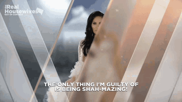 a woman in a white dress with the words " the only thing i 'm guilty of is being shah-mazing " below her