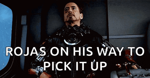 a man is sitting in a chair with the words rojas on his way to pick it up above him