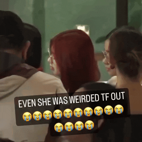 a woman with red hair is surrounded by other people with a caption that says even she was weirded tf out