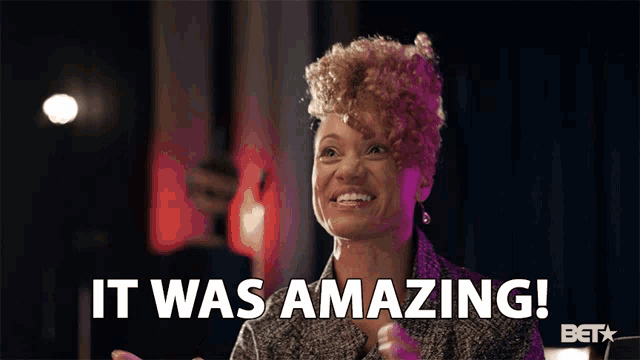 a woman says " it was amazing " while smiling