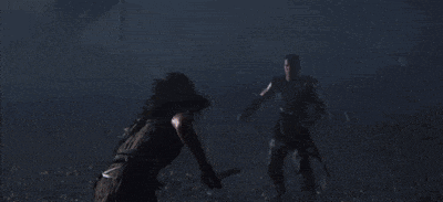a man and a woman are fighting with swords