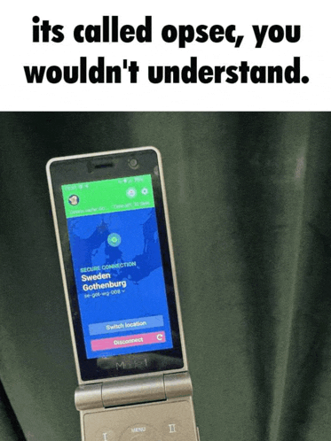 a flip phone with a screen that says its called opsec you wouldn t understand