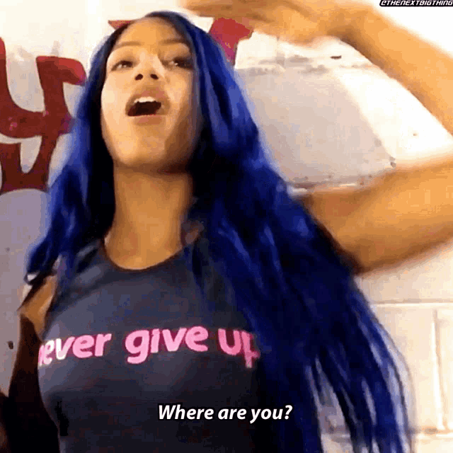 a woman with long blue hair is wearing a shirt that says " never give up "