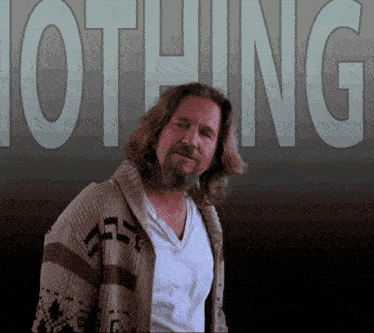 a man wearing a sweater stands in front of a sign that says nothing
