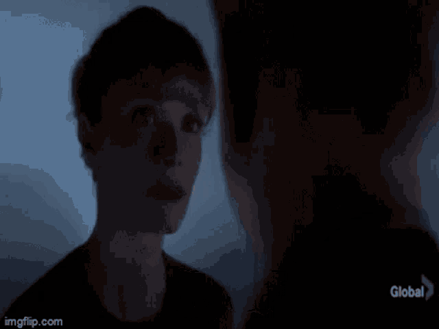 a woman is talking to a man in a dark room and the words `` i 'm fine '' are on the screen .